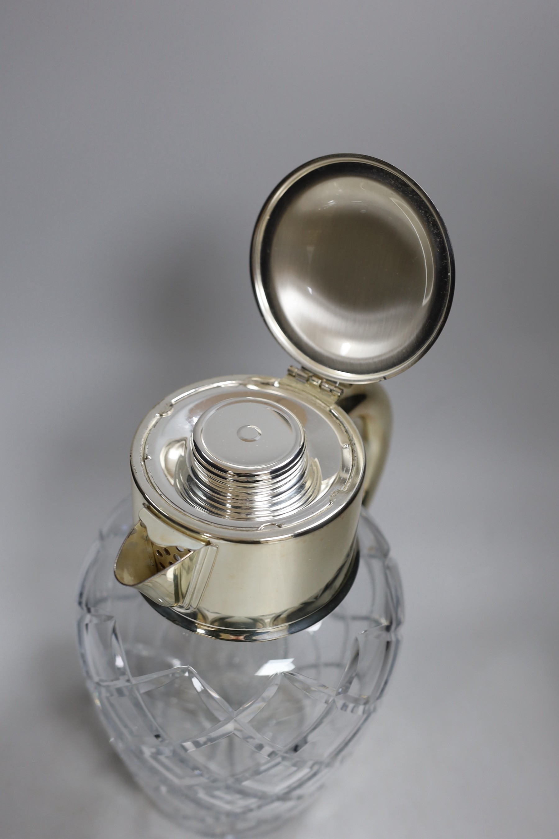 A large cut glass and silver plated jug, possibly for Pimms. 28cm tall